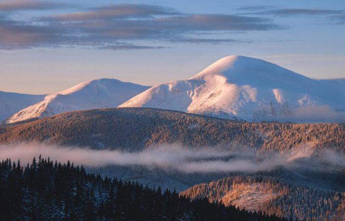 Winter mountain range and Goverla summit over morning sunrise light, Carpathians, Ukraine